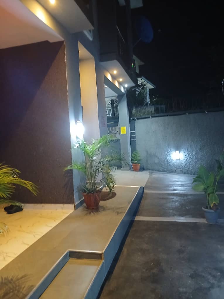 Walkway and parking area with planters
