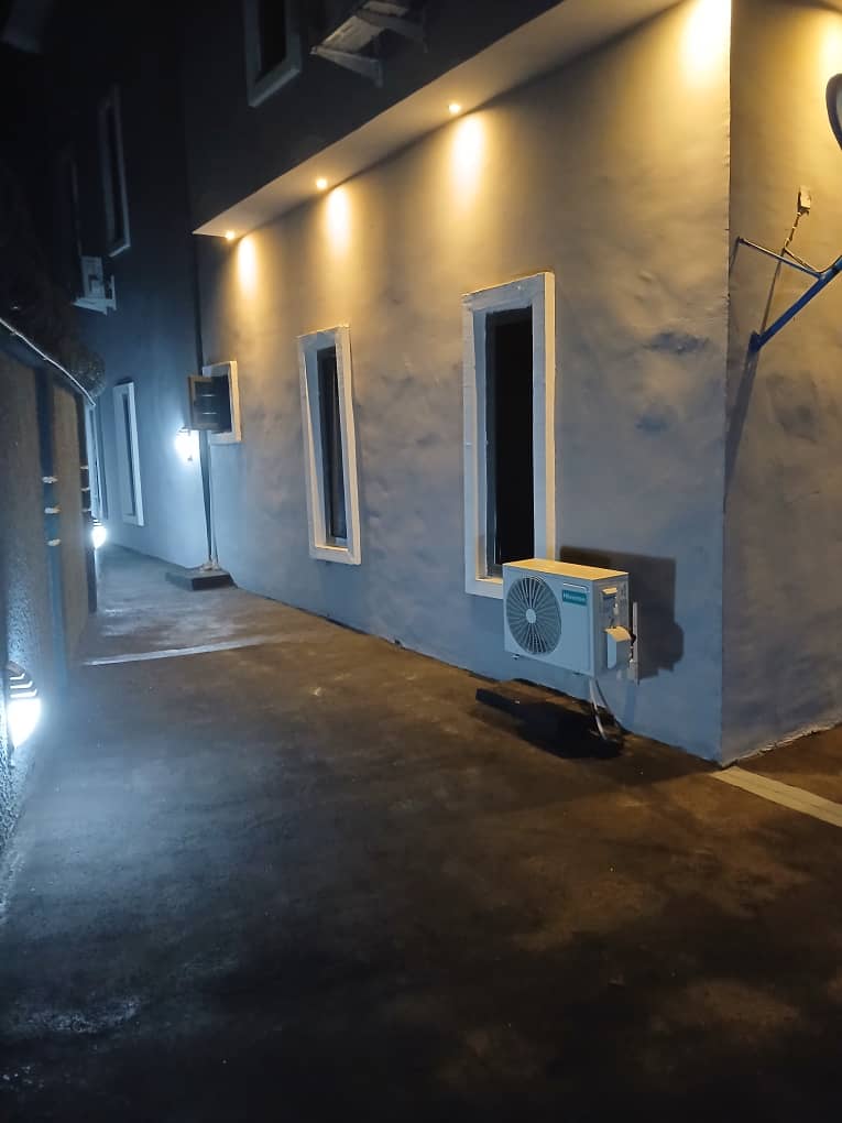 Apartment side walkway with accent lighting